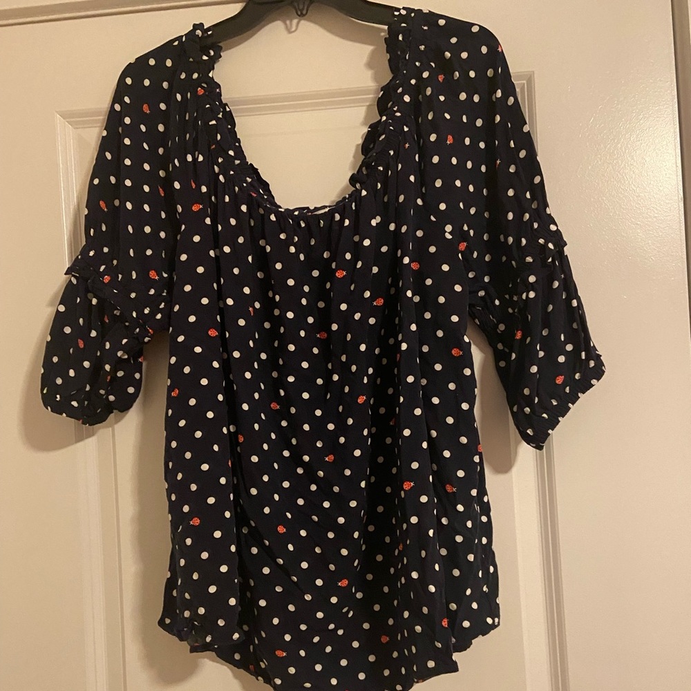 Navy and white polka dot top with ladybug detail